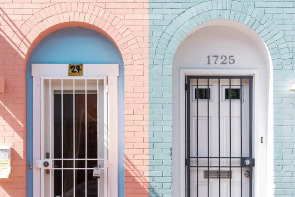 Two front doors. One with a correct number and one with a made up number