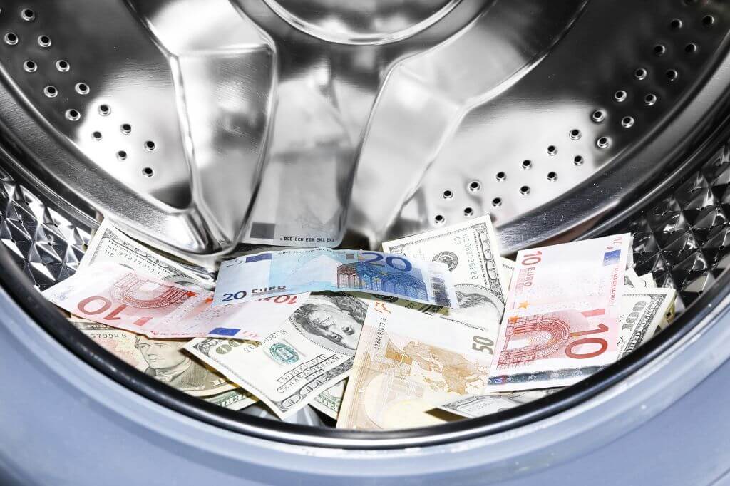 Money notes in a washing machine drum