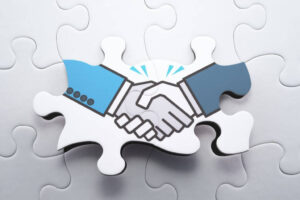 jigsaw pieces fit together demonstrating a handshake